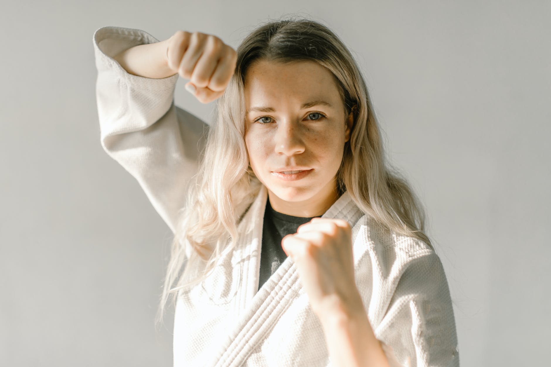 woman in white judo uniform