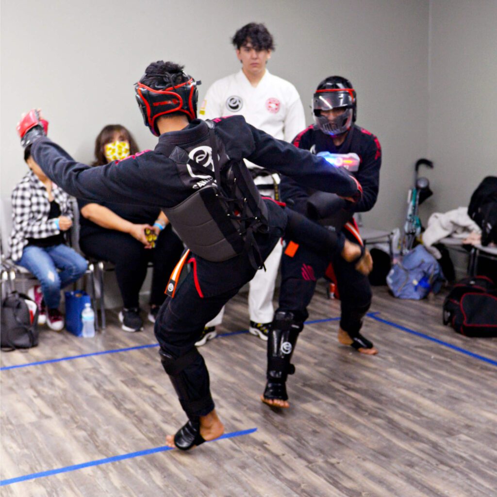 Competitors from Sakubara Academy competing for first and second place in the sparring division in a tournament.